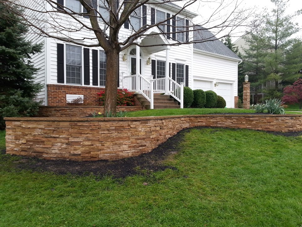 undulating retaining wall supporting terraced landscape