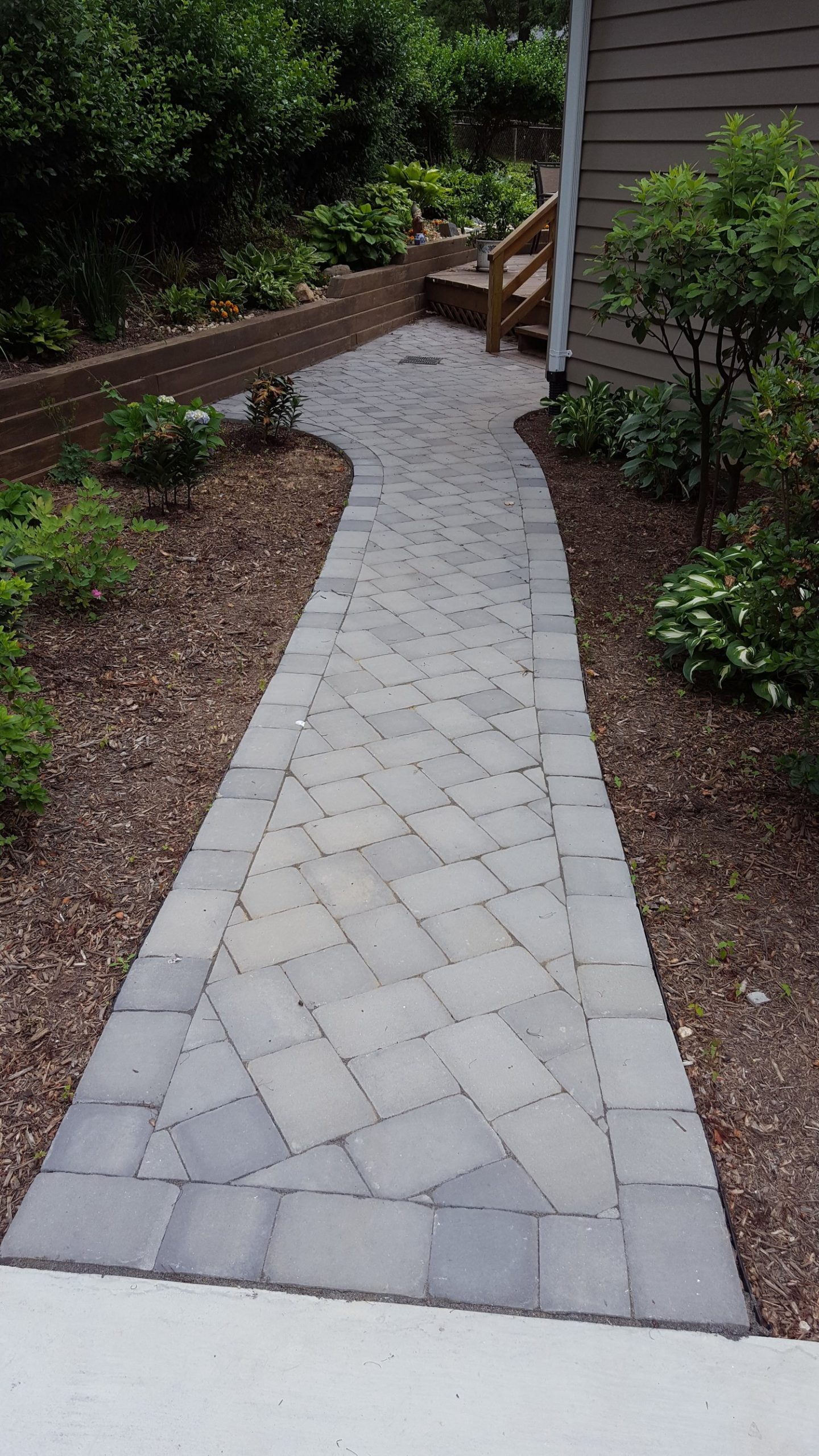 walkway from driveway to front door made of interlocking blocks